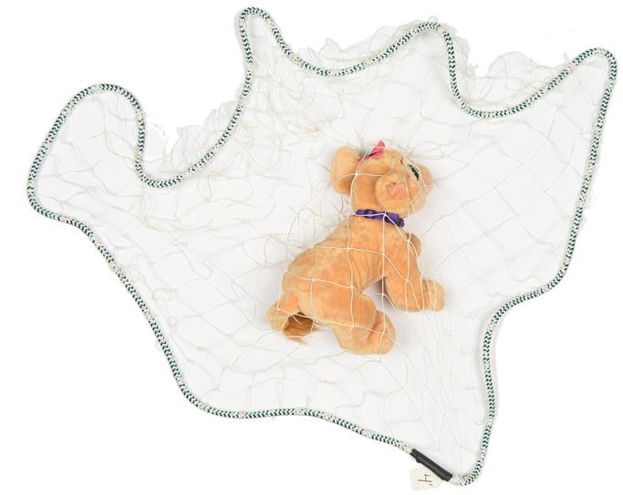 throw net demonstration with stuffed cat trapped beneath net, tranquilizer gun, non-lethal gun